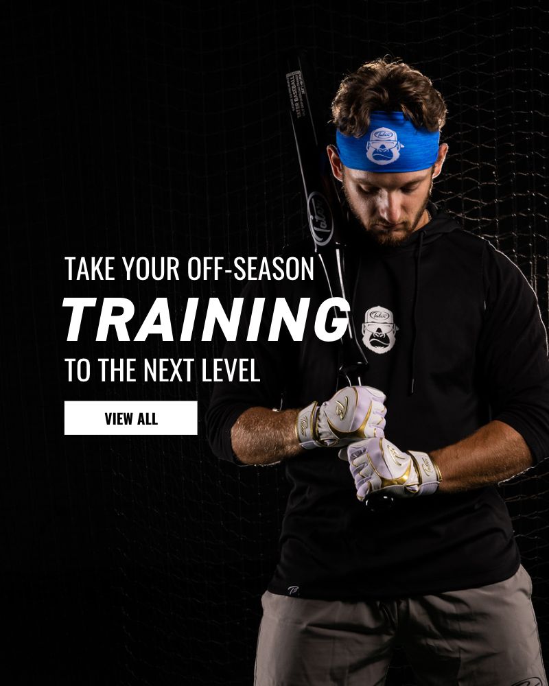 Justin Guerrera, a professional baseball player of the New York Mets, holds Tater's patent pending Overload Split Grip Training bat while wearing a black hoodie and blue headband showcasing the white Tater Kong. He also has on white Tater batting gloves.