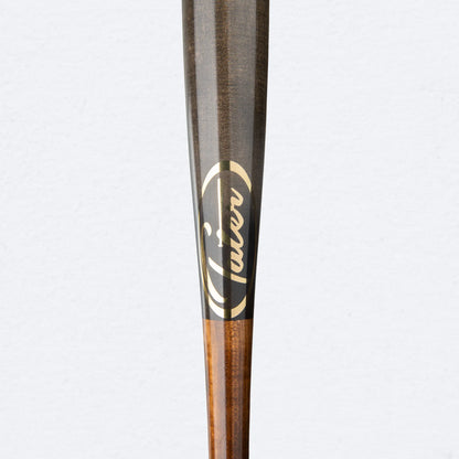 Close-up of Tater Baseball's high-quality maple wood bat, showcasing the brand logo and sleek wood grain finish.