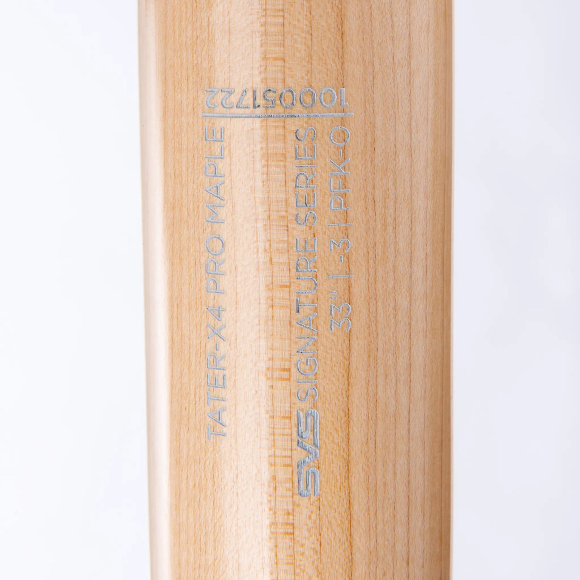 Close-up view of Tater Baseball's custom engraving on a maple wood bat, featuring the Tater-X4 Pro Maple and the SVS Signature Series logo with model number.